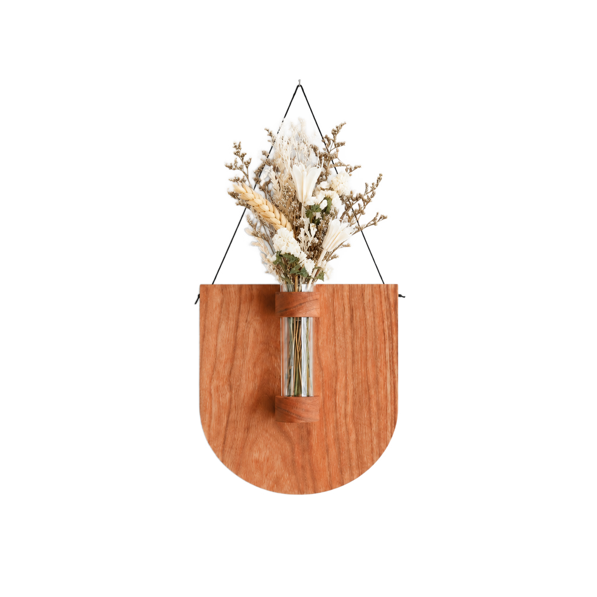 A wooden wall-mounted hanging planter with a curved shield shape, featuring a clear glass vase holding dried white and beige flowers, suspended by black wires against a light gray background.
